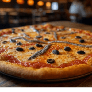 Pizza Anchois de Pizza Mania à Saint-Yrieix-la-Perche avec anchois, olives, fromage fondant et sauce tomate.